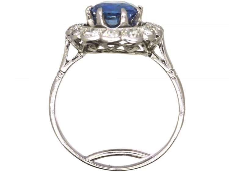 Early 20th Century French Import Platinum Large Cluster Ring set with a Sapphire & Diamonds