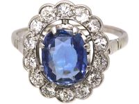 Early 20th Century French Import Platinum Large Cluster Ring set with a Sapphire & Diamonds