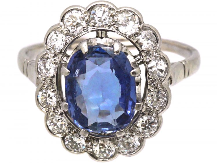 Early 20th Century French Import Platinum Large Cluster Ring set with a Sapphire & Diamonds
