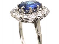 Early 20th Century French Import Platinum Large Cluster Ring set with a Sapphire & Diamonds