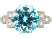 Art Deco Platinum Ring set with a Zircon with Stepped Diamond set Shoulders