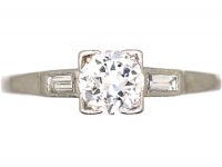Early 20th Century Platinum, Diamond Solitaire Ring with Baguette Diamond Shoulders