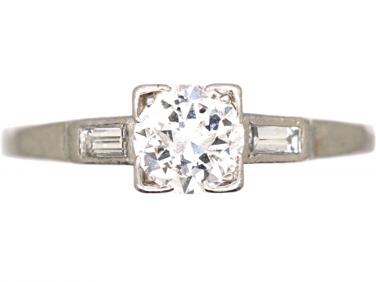 Early 20th Century Platinum, Diamond Solitaire Ring with Baguette Diamond Shoulders