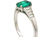 Art Deco 18ct White Gold Ring set with an Emerald with Step Cut Diamond Shoulders