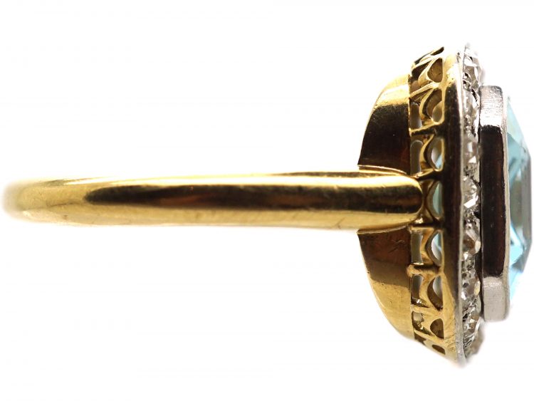 Edwardian 18ct Gold & Platinum Ring set with an Aquamarine with a Diamond Border