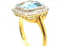 Edwardian 18ct Gold & Platinum Ring set with an Aquamarine with a Diamond Border