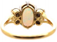 Edwardian 18ct Gold & Platinum Ring set with an Opal with Diamonds on Either Side