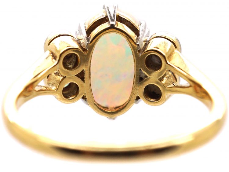 Edwardian 18ct Gold & Platinum Ring set with an Opal with Diamonds on Either Side