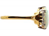 Edwardian 18ct Gold & Platinum Ring set with an Opal with Diamonds on Either Side