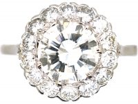 Mid 20th Century Platinum Diamond Cluster Ring set with 1.50 Carat Centre Diamond