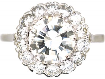 Mid 20th Century Platinum Diamond Cluster Ring set with 1.50 Carat Centre Diamond