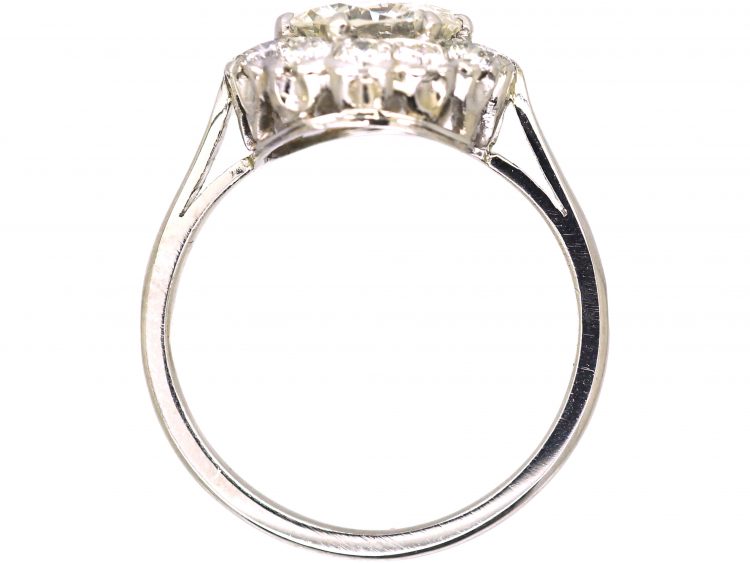 Mid 20th Century Platinum Diamond Cluster Ring set with 1.50 Carat Centre Diamond