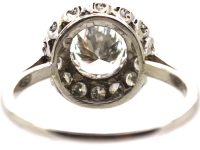 Mid 20th Century Platinum Diamond Cluster Ring set with 1.50 Carat Centre Diamond