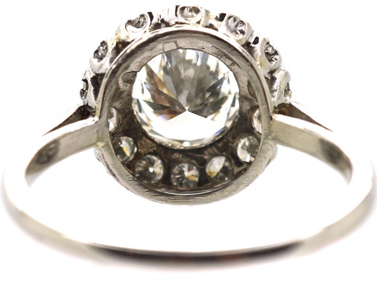 Mid 20th Century Platinum Diamond Cluster Ring set with 1.50 Carat Centre Diamond