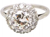 Mid 20th Century Platinum Diamond Cluster Ring set with 1.50 Carat Centre Diamond