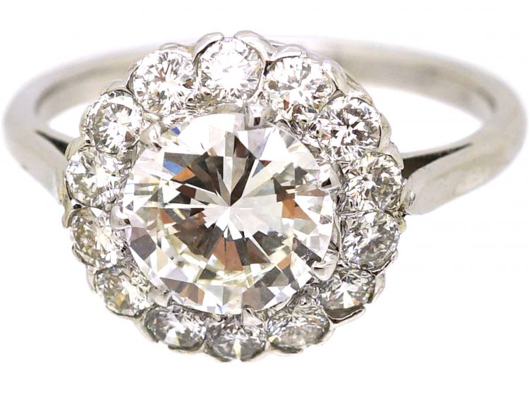 Mid 20th Century Platinum Diamond Cluster Ring set with 1.50 Carat Centre Diamond