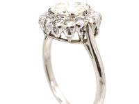 Mid 20th Century Platinum Diamond Cluster Ring set with 1.50 Carat Centre Diamond