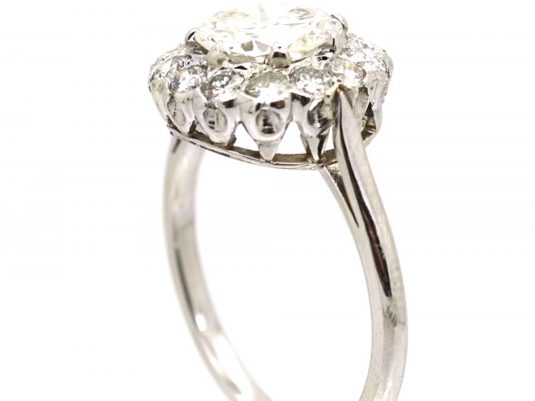 Mid 20th Century Platinum Diamond Cluster Ring set with 1.50 Carat Centre Diamond