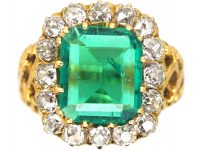 French Import 19th Century 18ct Gold Ring set with a Large Emerald surrounded by Diamonds