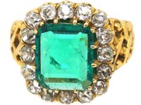 French Import 19th Century 18ct Gold Ring set with a Large Emerald surrounded by Diamonds