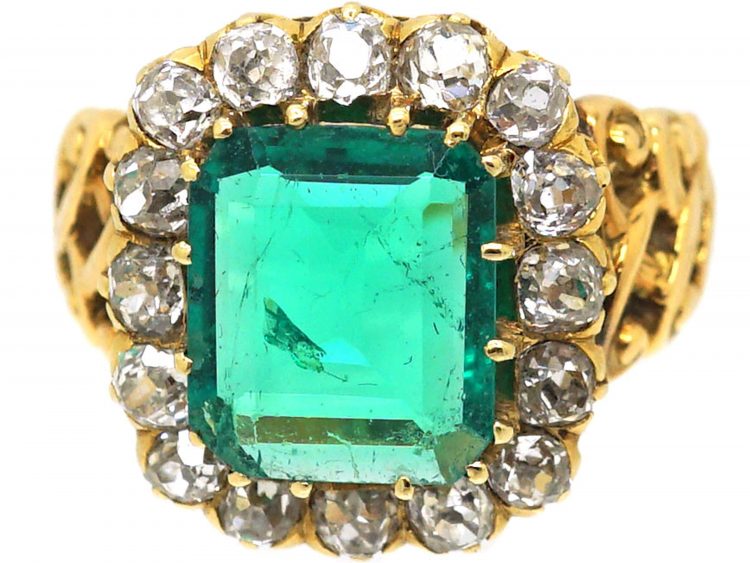 French Import 19th Century 18ct Gold Ring set with a Large Emerald surrounded by Diamonds