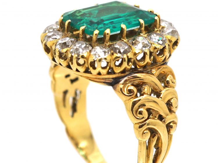 French Import 19th Century 18ct Gold Ring set with a Large Emerald surrounded by Diamonds