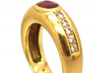 Modernist 18ct Gold Ring set with a Ruby and Diamond Shoulders
