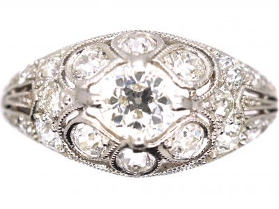 Early 20th Century Platinum, Diamond Cluster Ring with Diamond Set Shoulders