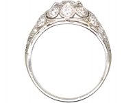 Early 20th Century Platinum, Diamond Cluster Ring with Diamond Set Shoulders
