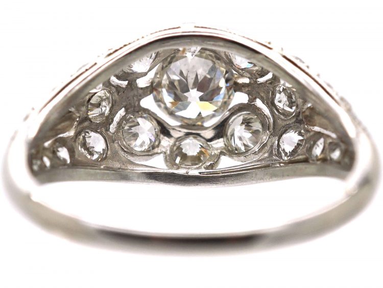 Early 20th Century Platinum, Diamond Cluster Ring with Diamond Set Shoulders