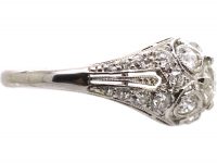 Early 20th Century Platinum, Diamond Cluster Ring with Diamond Set Shoulders