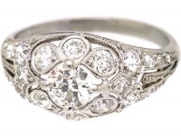 Early 20th Century Platinum, Diamond Cluster Ring with Diamond Set Shoulders