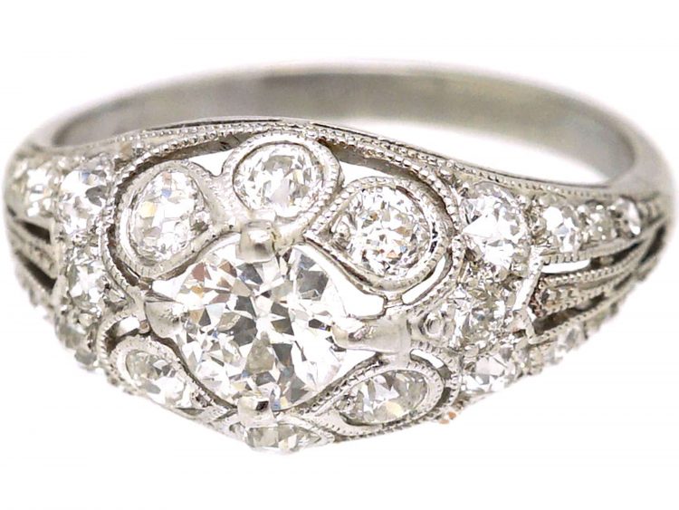 Early 20th Century Platinum, Diamond Cluster Ring with Diamond Set Shoulders