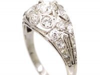 Early 20th Century Platinum, Diamond Cluster Ring with Diamond Set Shoulders