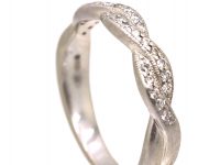 Early 20th Century Platinum Ribbon Design Ring set with Diamonds