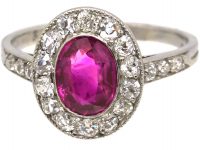 Edwardian Platinum, Ruby & Diamond Cluster Ring with Diamond set Shoulders