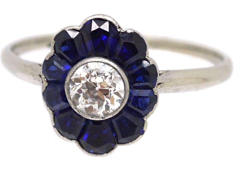 Art Deco Platinum, Flower Ring set with a Diamond with Sapphire Petals