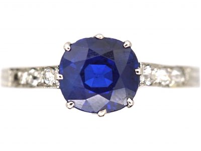 Early 20th Century Platinum Ring set with a Sapphire with Diamond set Shoulders