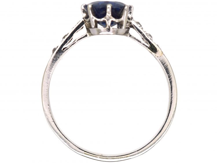 Early 20th Century Platinum Ring set with a Sapphire with Diamond set Shoulders