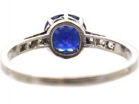 Early 20th Century Platinum Ring set with a Sapphire with Diamond set Shoulders