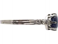 Early 20th Century Platinum Ring set with a Sapphire with Diamond set Shoulders