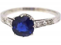 Early 20th Century Platinum Ring set with a Sapphire with Diamond set Shoulders