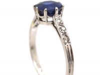 Early 20th Century Platinum Ring set with a Sapphire with Diamond set Shoulders