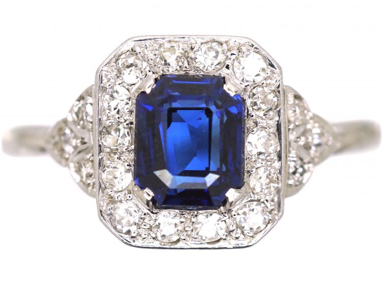 Platinum Diamond Cluster Ring Set With An Emerald Cut Sapphire