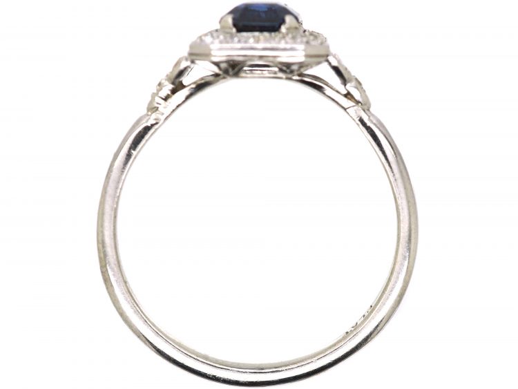 Platinum Diamond Cluster Ring Set With An Emerald Cut Sapphire