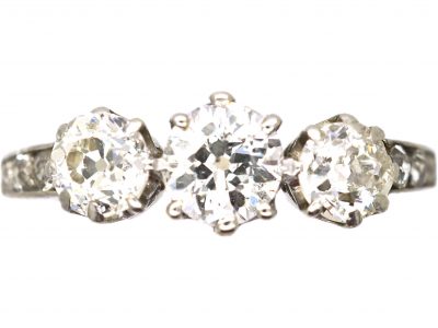Early 20th Century Platinum, Three Stone Diamond Ring with Diamond set Shoulders