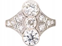 Art Deco Platinum Ring set with Three Diamonds with Smaller Diamonds on Either Side