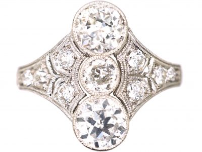 Art Deco Platinum Ring set with Three Diamonds with Smaller Diamonds on Either Side