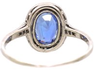 Art Deco Platinum Ring set with an Oval Sapphire & Small Diamonds