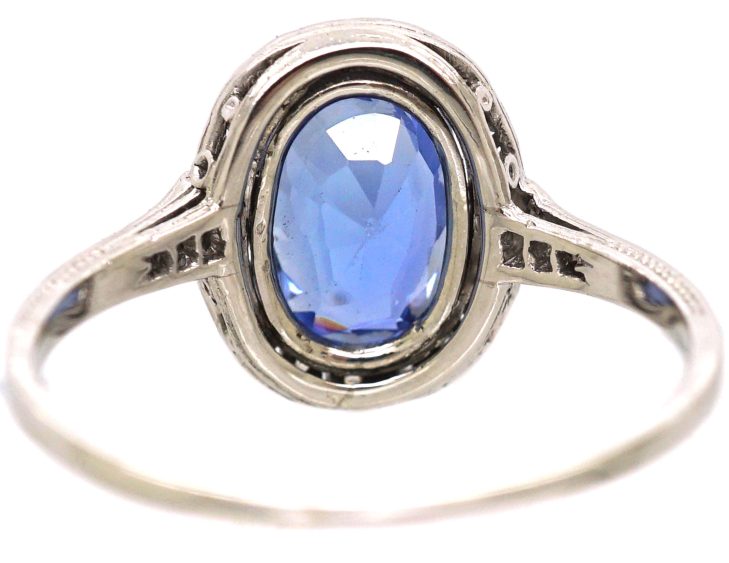 Art Deco Platinum Ring set with an Oval Sapphire & Small Diamonds